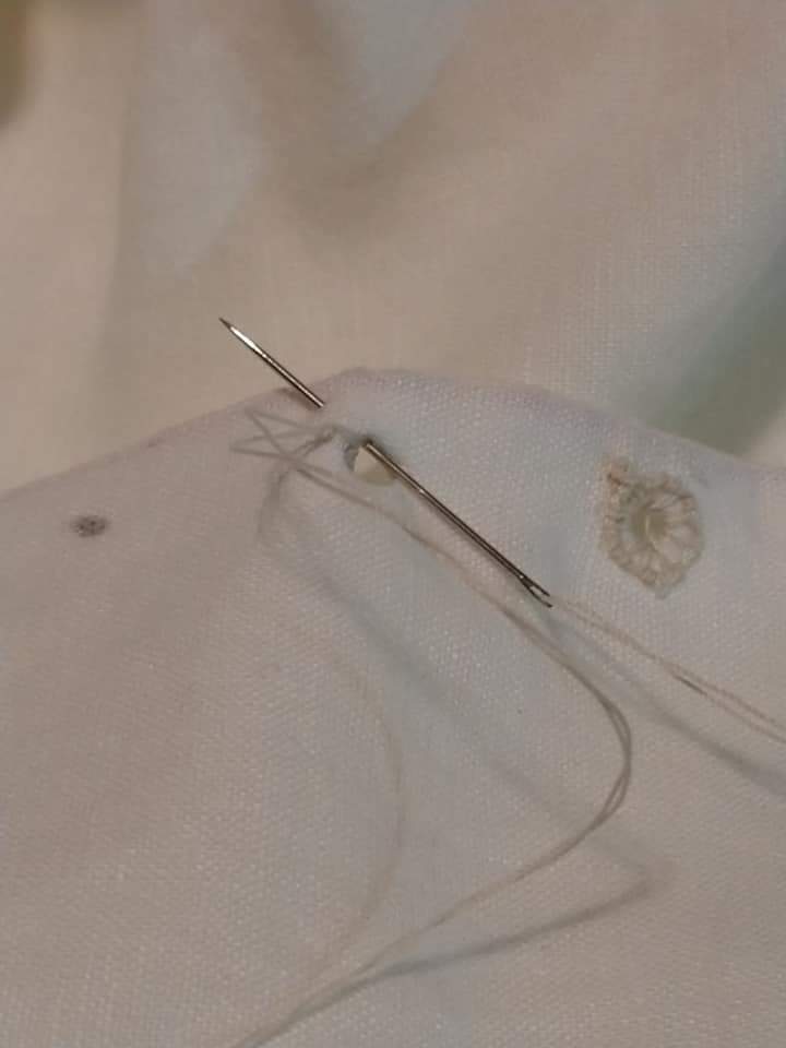 Button hole stitch around the lacing hole